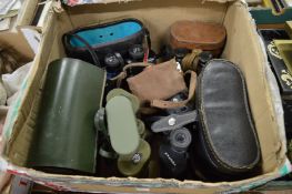 Various binoculars and a box camera.