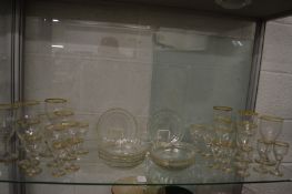 Part suite of glassware with gilded rims.