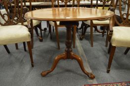 A George III mahogany circular tilt-top bird cage tripod table, the cabriole legs ending with carved