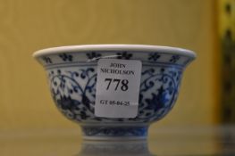 A small Chinese blue and white bowl.