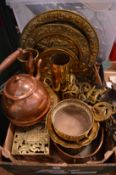 A quantity of brass and copper ware to include a pair of shell cases, embossed dishes etc.