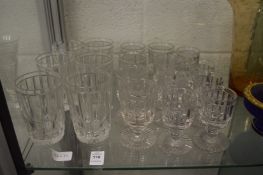 Part suite of moulded and cut glass drinking glasses.