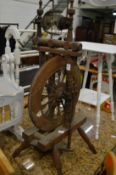 An old spinning wheel.