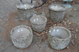Five various reconstituted stone planters.