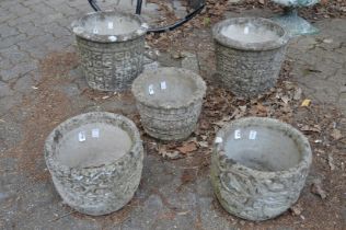 Five various reconstituted stone planters.