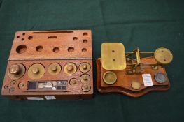 A box set of weights and postal scales and weights.