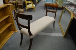 A 19th century and later mahogany and upholstered window seat.