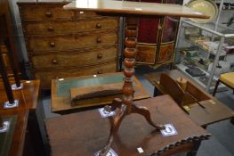A mahogany tripod table.