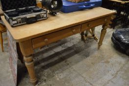 A rustic pine two drawer side-table.