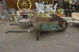 An old wooden wheelbarrow.
