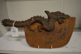 A Tibetan bronze dragon axe.