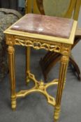 A matched pair of French style marble top gilt wood stands or occasional tables.