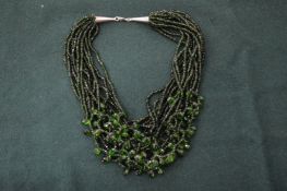 A decorative chunky bead necklace.
