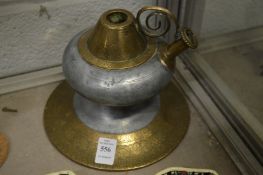 An 18th/19th century Indian brass and zinc huqqa base.