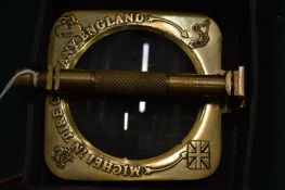 A novelty magnifying glass, cased.