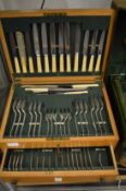 An oak cased canteen of cutlery.