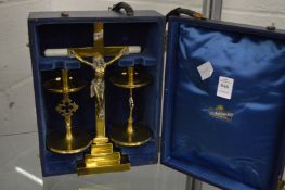 A travelling alter set comprising, brass crucifix mounted with a model of Christ together with a