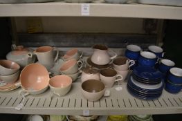 A quantity of Poole pottery and Denby coffee cups, saucers and plates.
