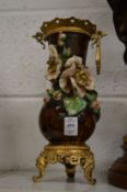 A pair of ormolu mounted pottery vases (faults).