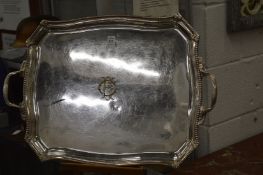 A large silver plated tray engraved with initials.