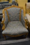 A French fauteuil with gilt wood frame.