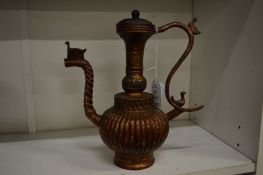 An Islamic bronze ewer.