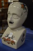 A reproduction pottery phrenology head.