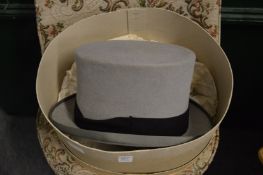 A grey top hat size 7.