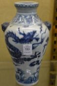 A Chinese blue and white dragon vase.