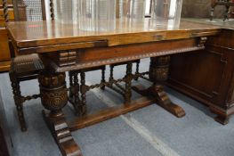 An oak refectory style draw leaf dining table.