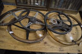 Five various early steering wheels.