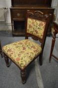 Floral upholstered Victorian walnut chair.