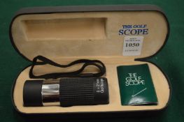 A boxed golfing scope.