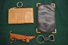 A Coach purse, leather wallet and key ring.