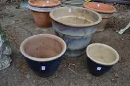 Three glazed plant pots.