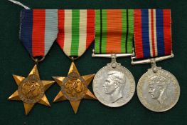 Four military medals.