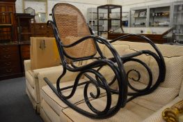 An ebonised bentwood rocking chair, probably Thonet.