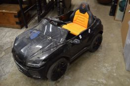 A childs battery operated car (af).