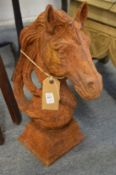 A pair of cast iron horse head gatepost finials.