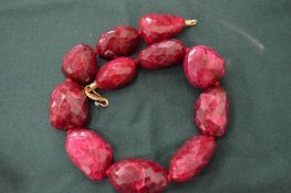 A decorative chunky bead necklace.