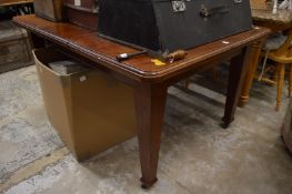 Late Victorian walnut wind-out extending dining table with one leaf.