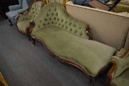 A good Victorian walnut framed chaise longue with carved decoration.