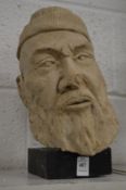 Plaster head of an Arab.