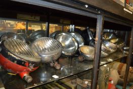 A quantity of old car headlights.