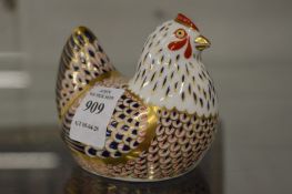 A Royal Crown Derby model of a chicken.
