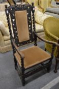 A carved oak framed carver chair.