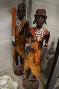 A pair of decorative African carved wood figures.