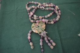 A decorative chunky bead necklace.
