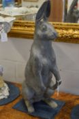 A cast lead model of hare standing on its hind legs.