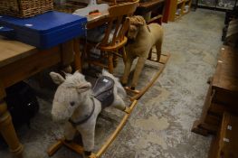 Two rocking horses and a puppet theatre.